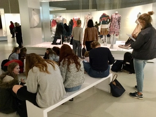 Textile students are engrossed in a history of fashion
