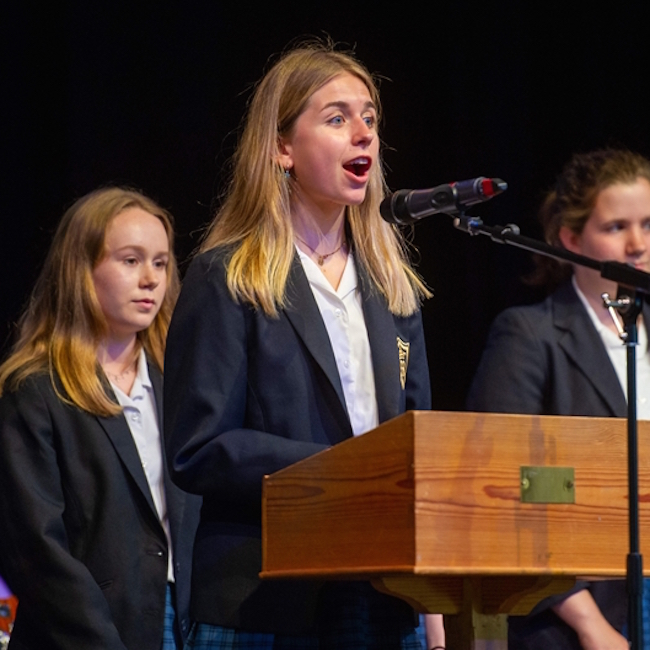 Student speaking on stage