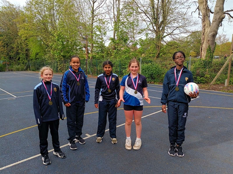 Nine games, nine wins: Junior School girls dominate Bee Netball Tournament!