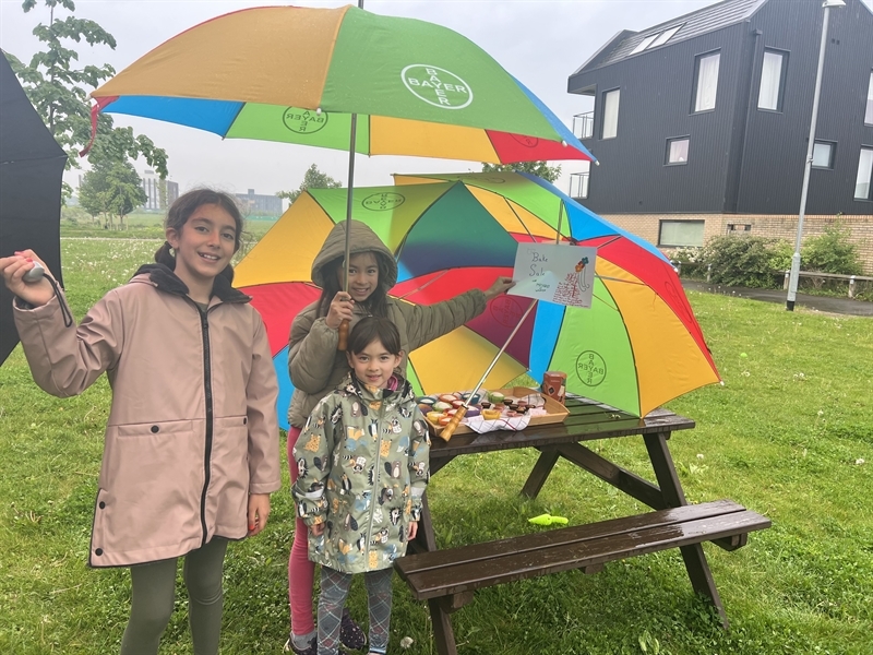Students brave the weather during Charity Week at the Junior School
